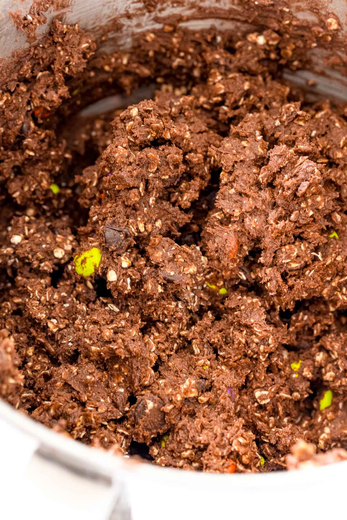 Chocolate oatmeal cookie dough in a mixing bowl.