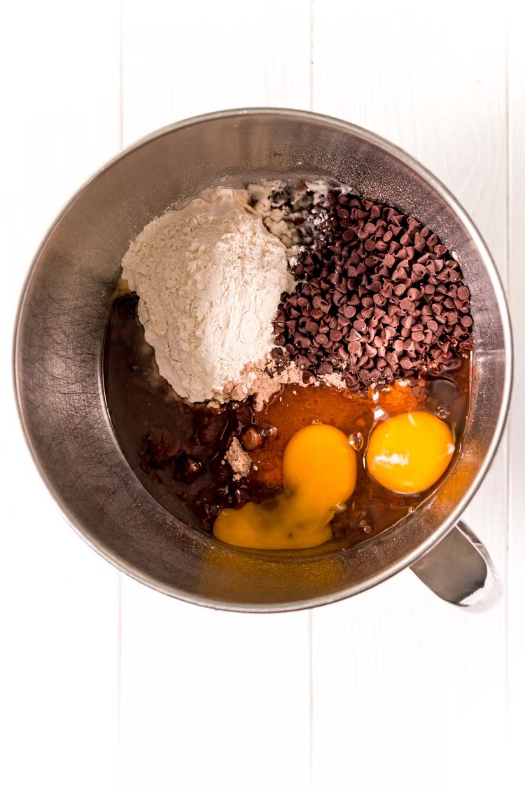 Ingredients in a stand mixer bowl to make brownie cookies.