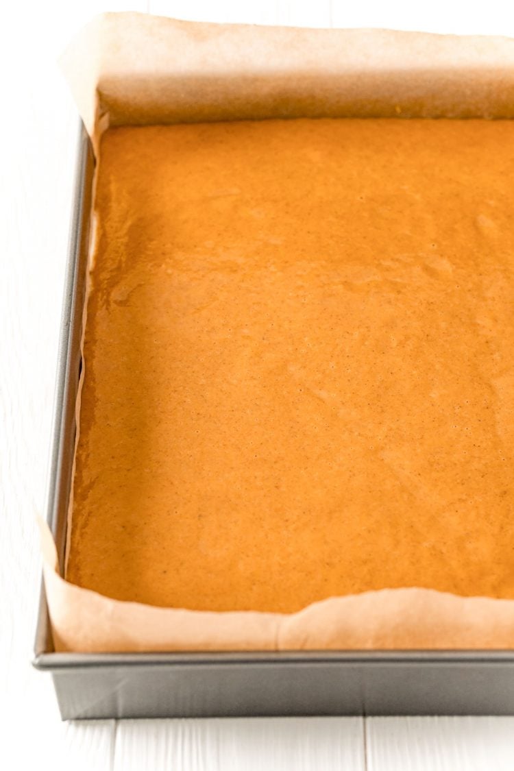 Pumpkin pie filling in a 9x13-inch baking pan.