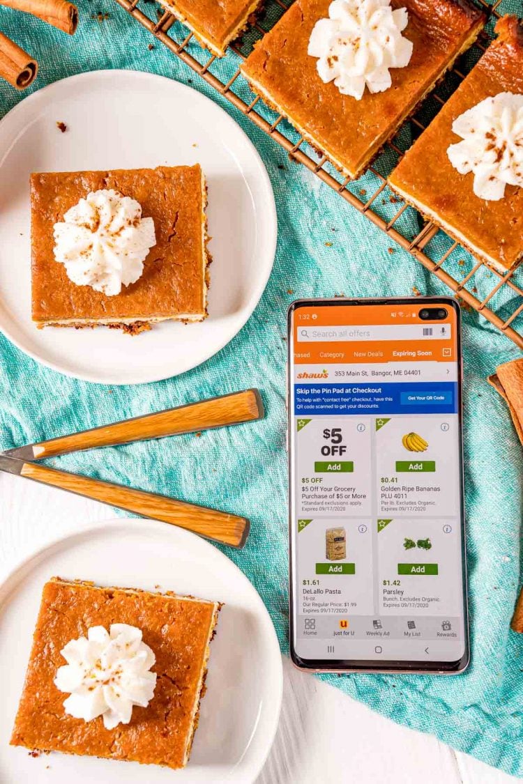 Overhead photo of the Shaw's app open on a phone surrounded by pumpkin pie bars.