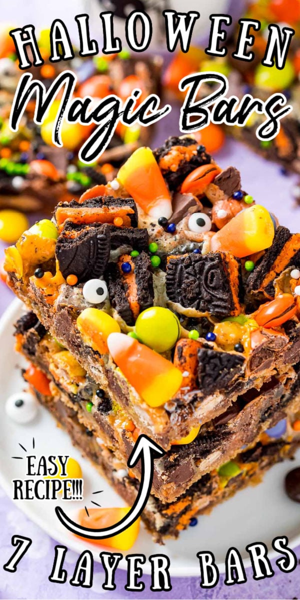 Halloween Seven Layer Bars are piled high with treats! A base of refrigerated chocolate chip cookie dough is topped with layers of Oreos, chocolate chunks, Reeses Pieces, M&Ms, and gooey sweetened condensed milk. The finishing touch is a handful of candy corn and some Halloween sprinkles! via @sugarandsoulco