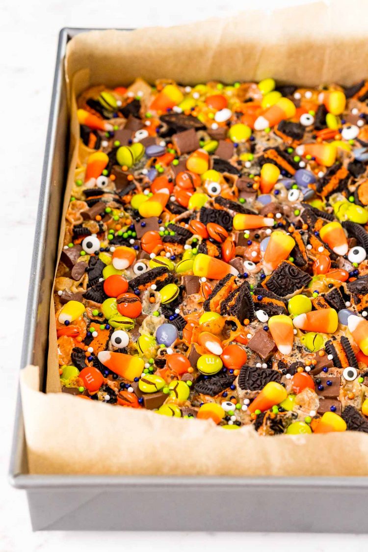 Halloween Magic 7 layer bars in a baking pan.