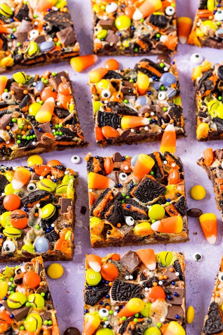 Halloween 7 layer bars on a purple surface.