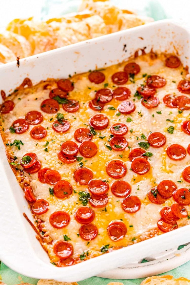 Pizza dip in a white square baking dish.