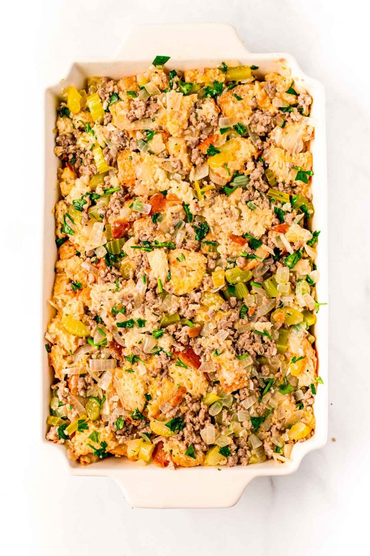 Overhead photo of a casserole dish with stuffing in it ready to be baked.