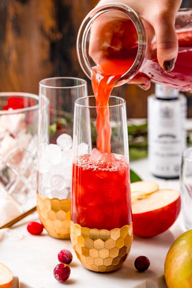 Punch being poured into a serving glass.