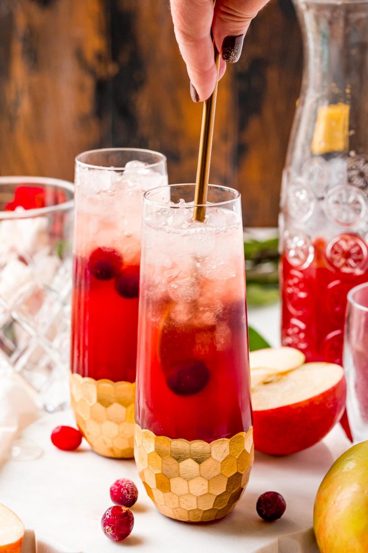 A drink being stirred with a spoon.