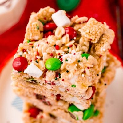 Close up photo of a stack of rice krispie treats with m&ms.