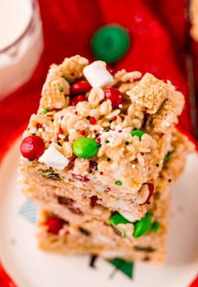Close up photo of a stack of rice krispie treats with m&ms.