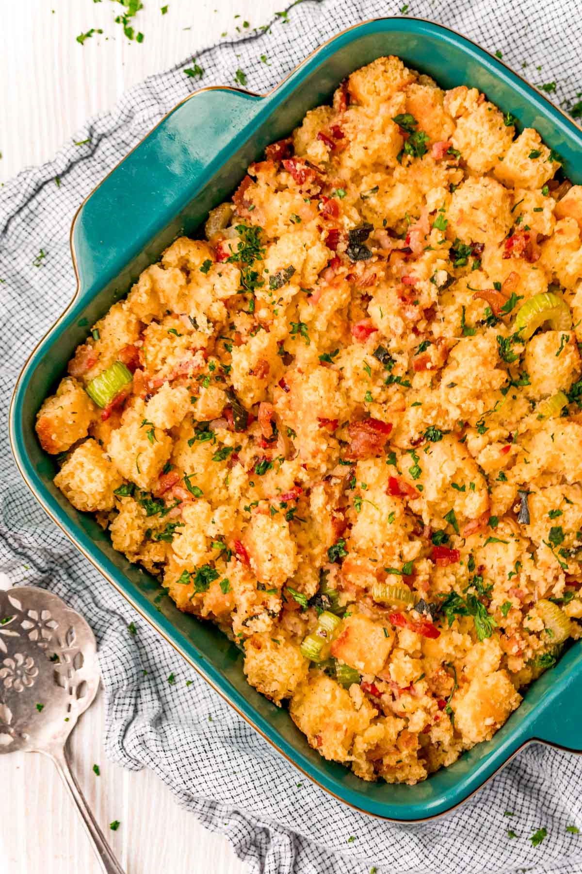 Overhead photo of a casserole dish with cornbread dressing in it.