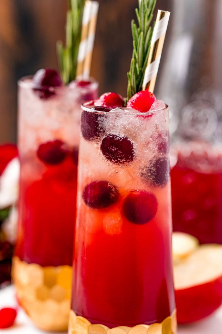 Super close up photo of a cranberry cocktail in a stemless champagne glass.