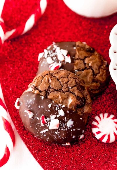 Close up photo of Peppermint brownie cookies on a red glittery surface.