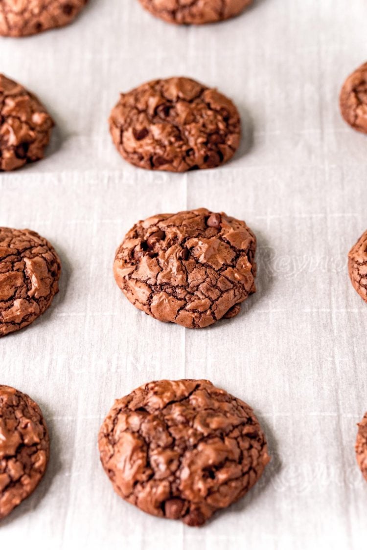 Brownie cookies on a parchment lined baking sheet.