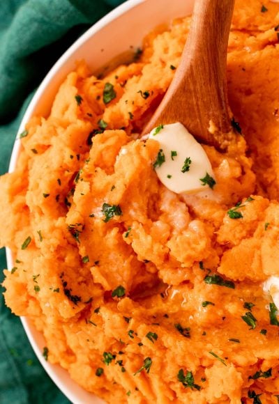 Savory Mashed Sweet Potatoes are filled with delicious tangy flavor! The potatoes are roasted in the oven until tender, then mashed with butter, buttermilk, dijon mustard, salt, and pepper.