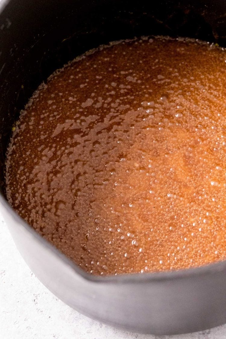 butter and sugar mixture boiling in a nonstick pot.