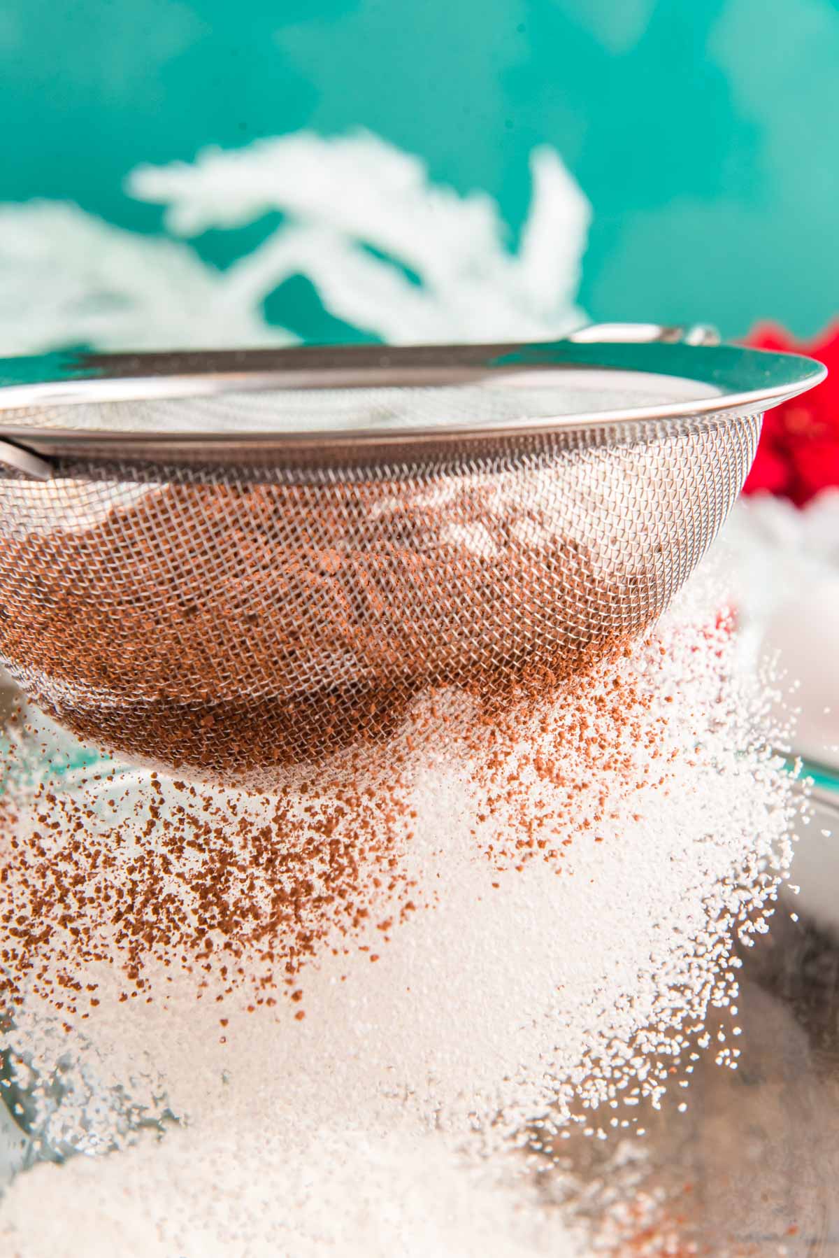 Cocoa powder and flour being sifted together.