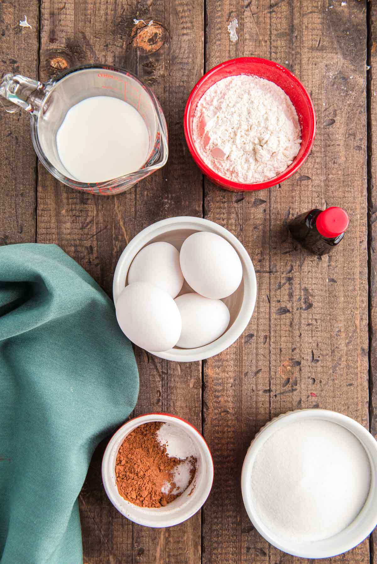 Overhead photo of the ingredients to make the sponge cake for a cake roll.