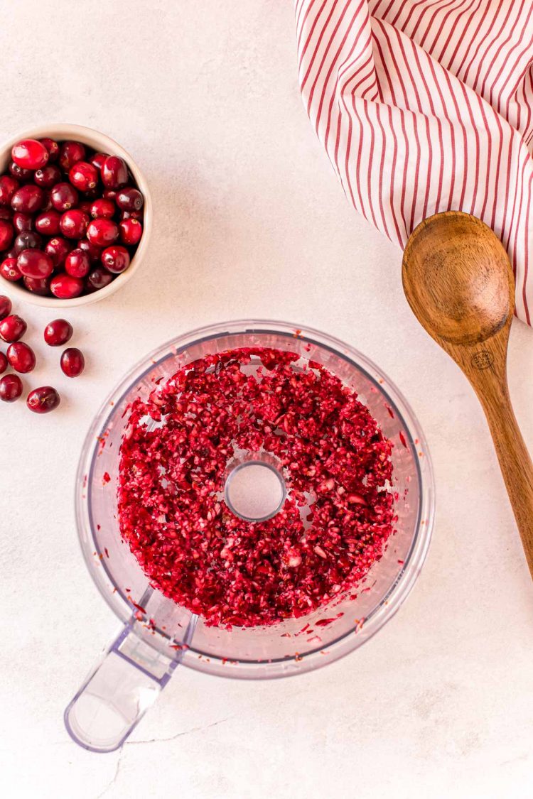 Overhead photo of cranberries that have been chopped in a food processor.