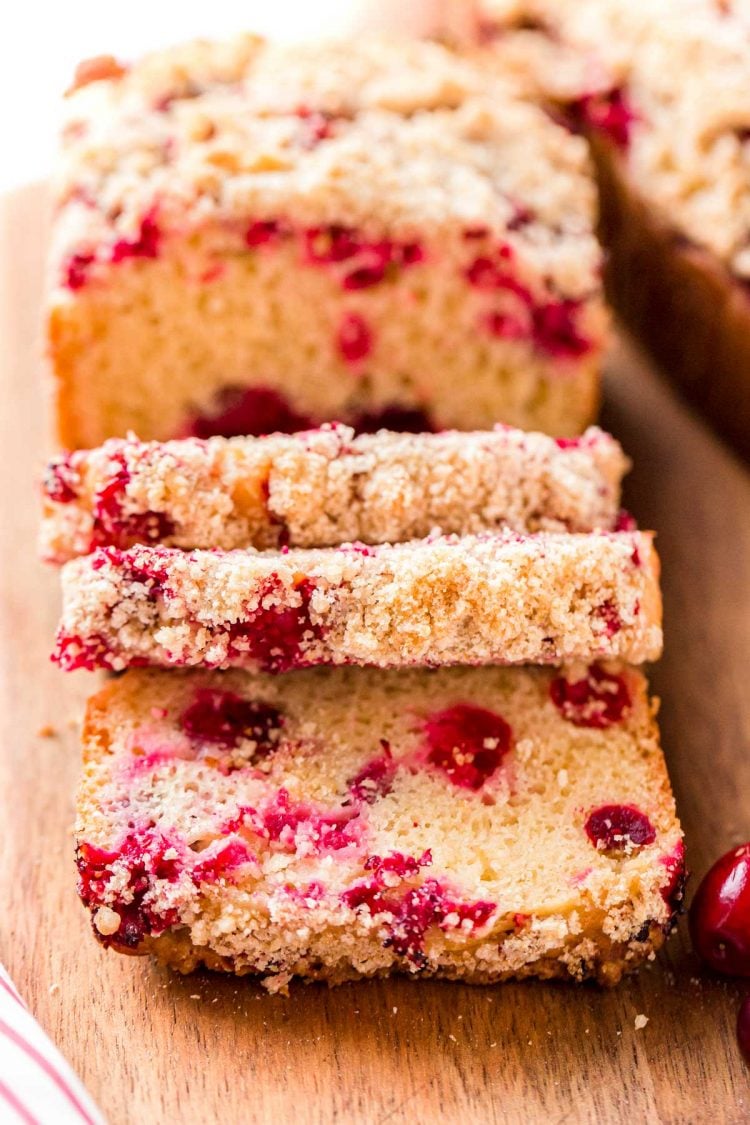 Close up photo of cranberry bread that has been partially sliced.
