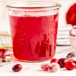 Close up photo of a weck jar filled with cranberry simple syrup.