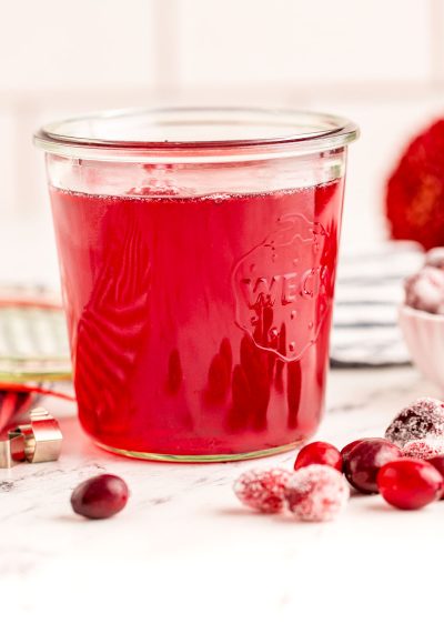 Close up photo of a weck jar filled with cranberry simple syrup.