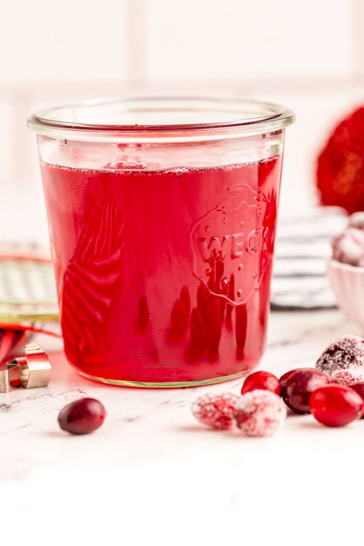 Close up photo of a weck jar filled with cranberry simple syrup.