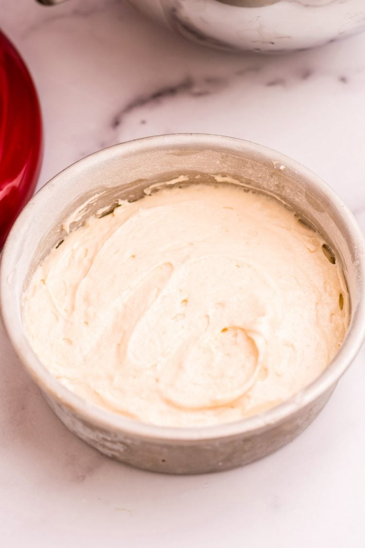 Cake batter in a cake pan ready to be baked.