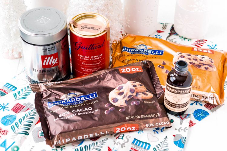 Ingredients to make cookies on a table covered in holiday decor.