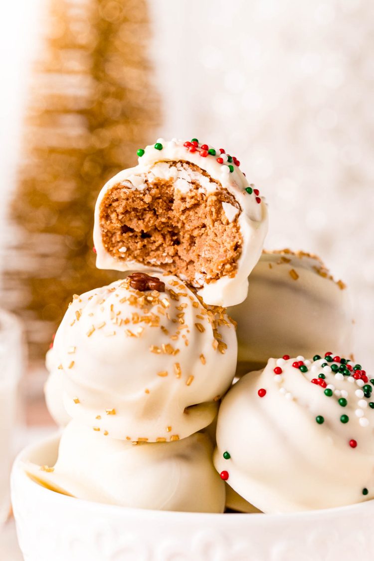 Close up photo of gingerbread truffles stacked in a white cup.