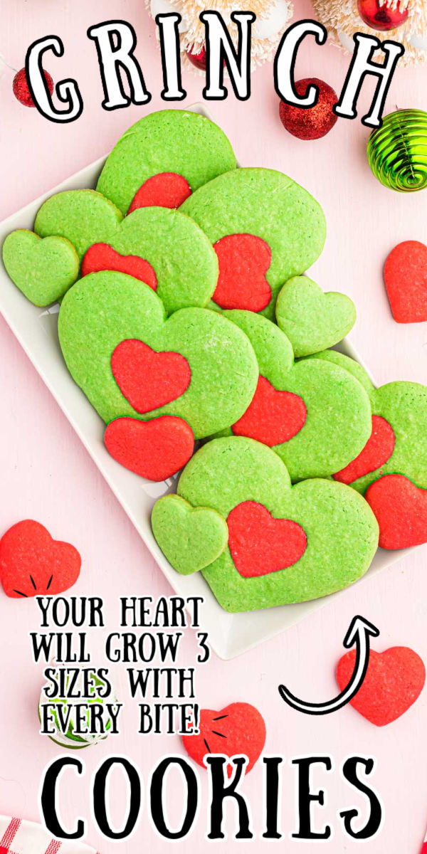 These Heart-Shaped Grinch Cookies were inspired by the most recent adaptation of How The Grinch Stole Christmas! Made with a basic sugar cookie dough and colored red and green to create the cutest cookies of the season! via @sugarandsoulco