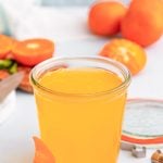 Close up photo of orange simple syrup.