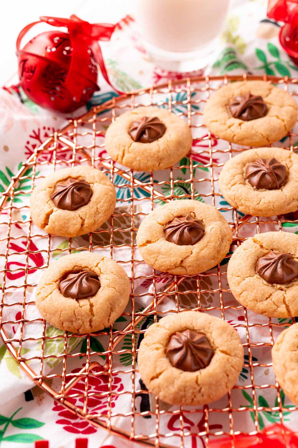 Peanut butter blossoms on a copper wire rack.