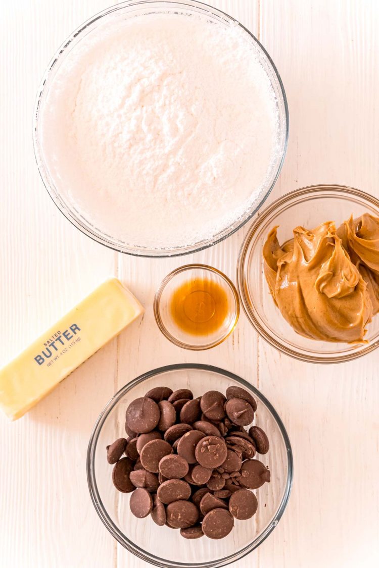 Overhead photo of ingredients used to make Peanut Butter Buckeyes on a white table.