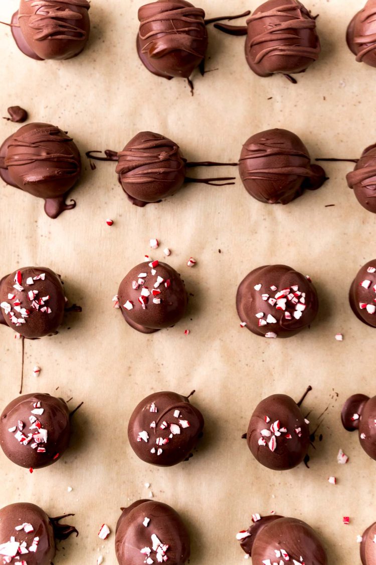 Overhead photo of Oreo balls on a parchment-lined baking sheet.