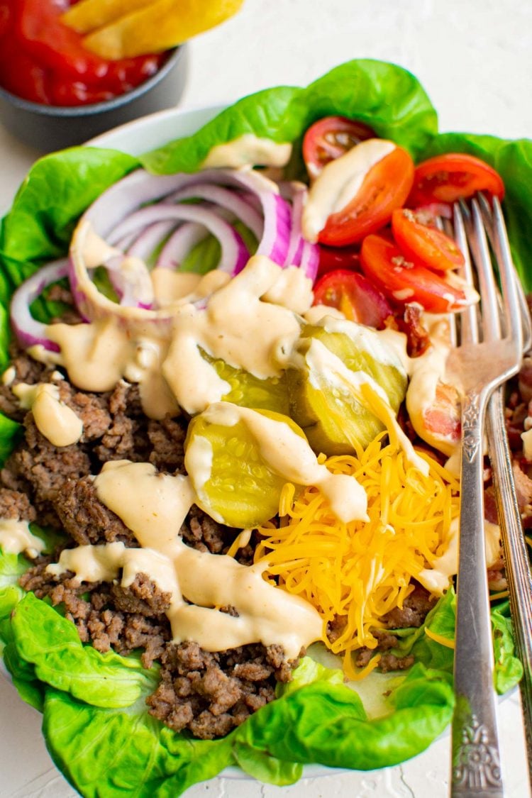 Close up photo of burger bowl with a fork in it.