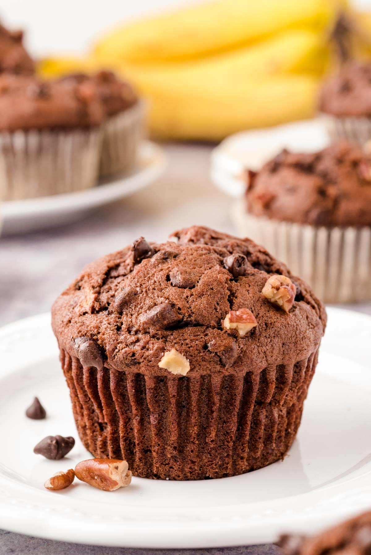 Chocolate Banana Muffins on a white plate.