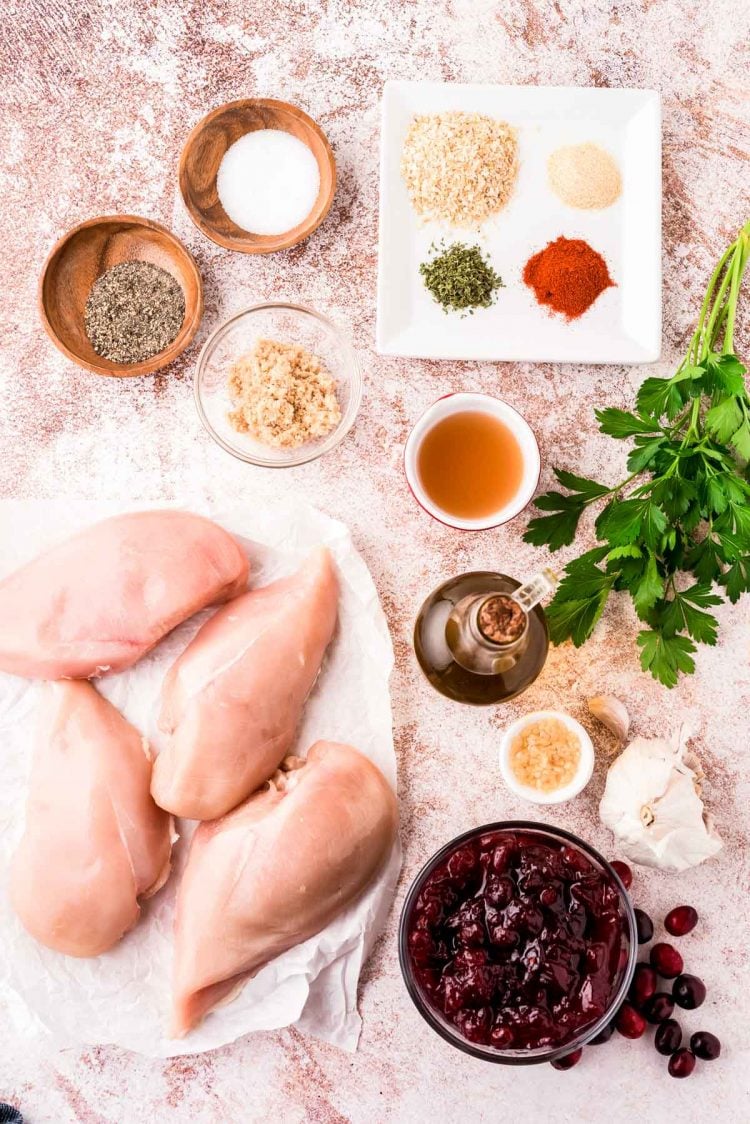 Ingredients to make cranberry chicken prepared on a table.