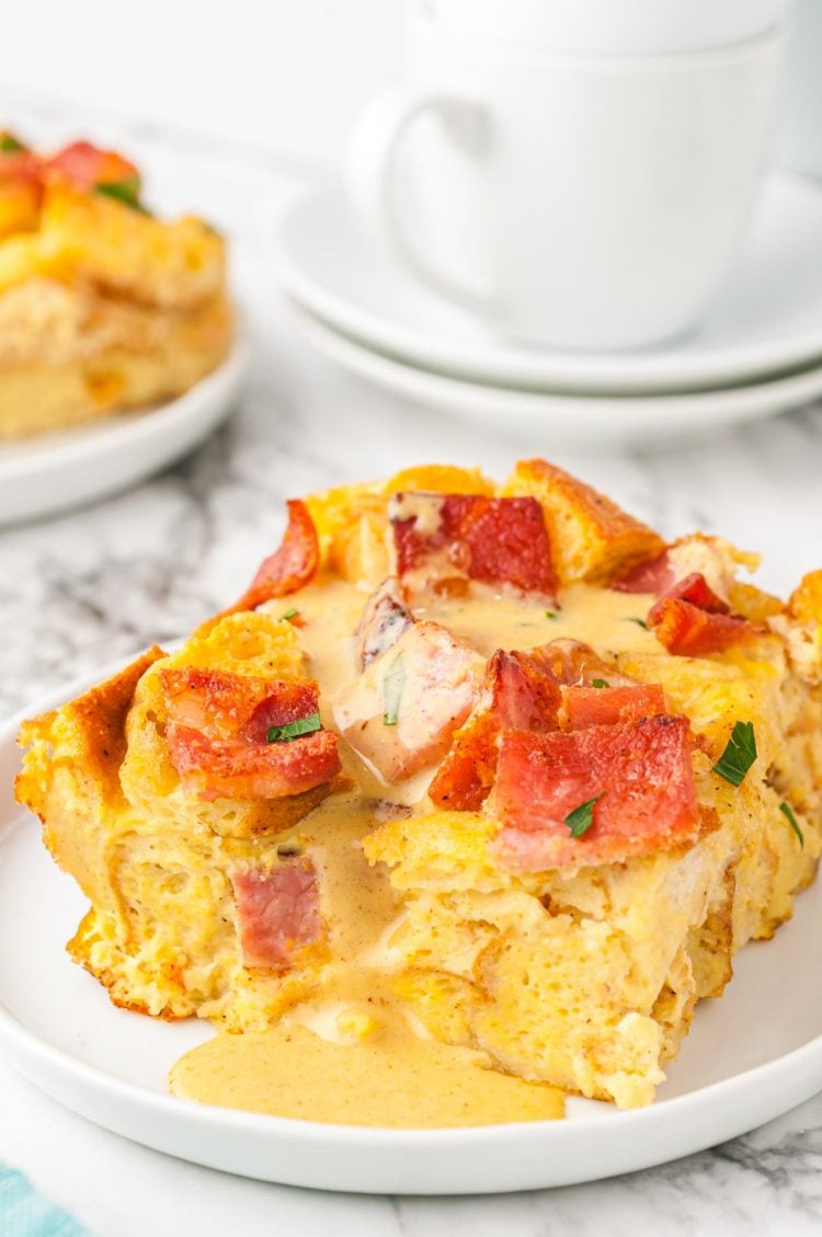 A slice of breakfast casserole on a white plate.