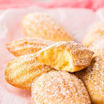 Close up photo of French Madeleines on a pink napkin.