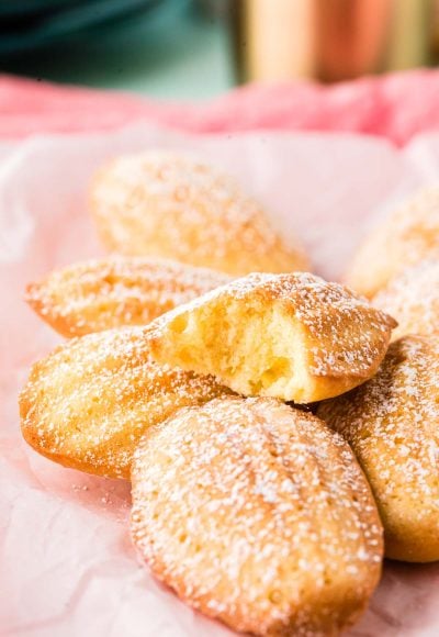 Close up photo of French Madeleines on a pink napkin.