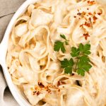 Overhead photo of a bowl on instant pot chicken alfredo.