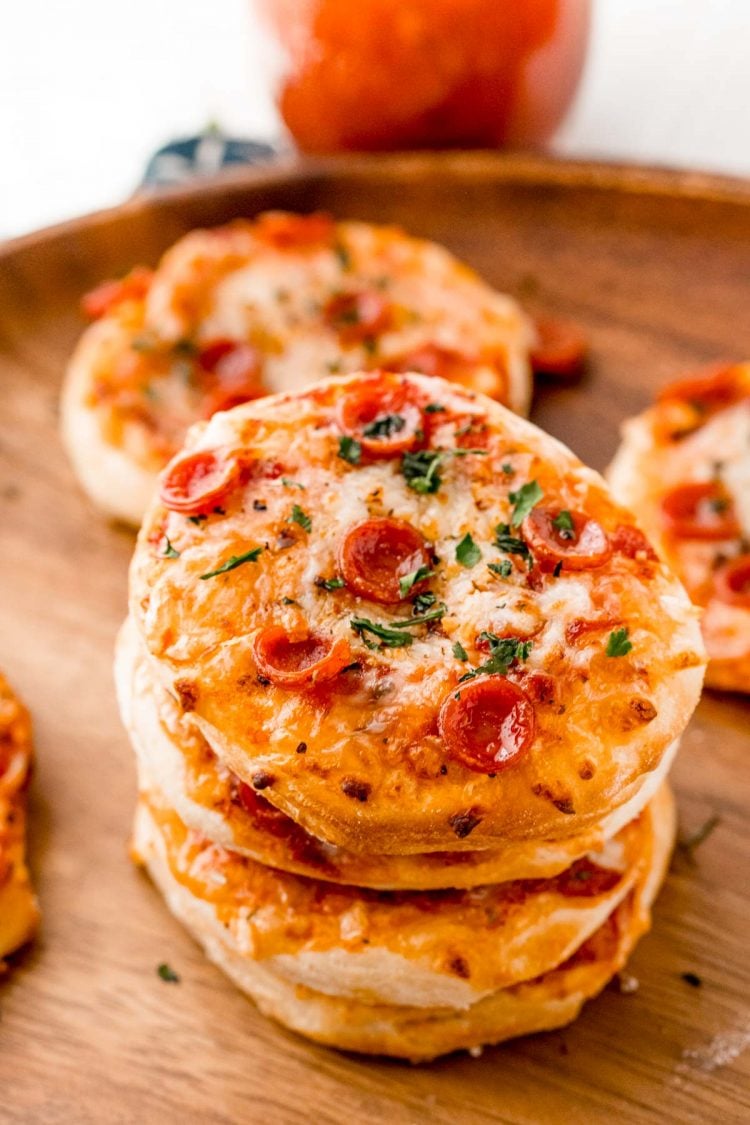 Three mini pizzas stacked on top of each other.