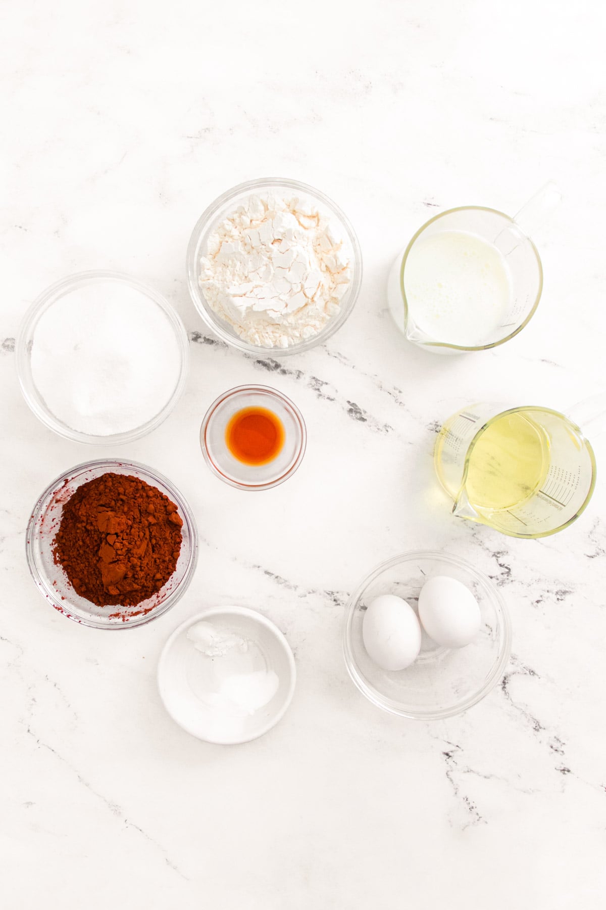 Ingredients to make chocolate cupcakes in prep bowls.