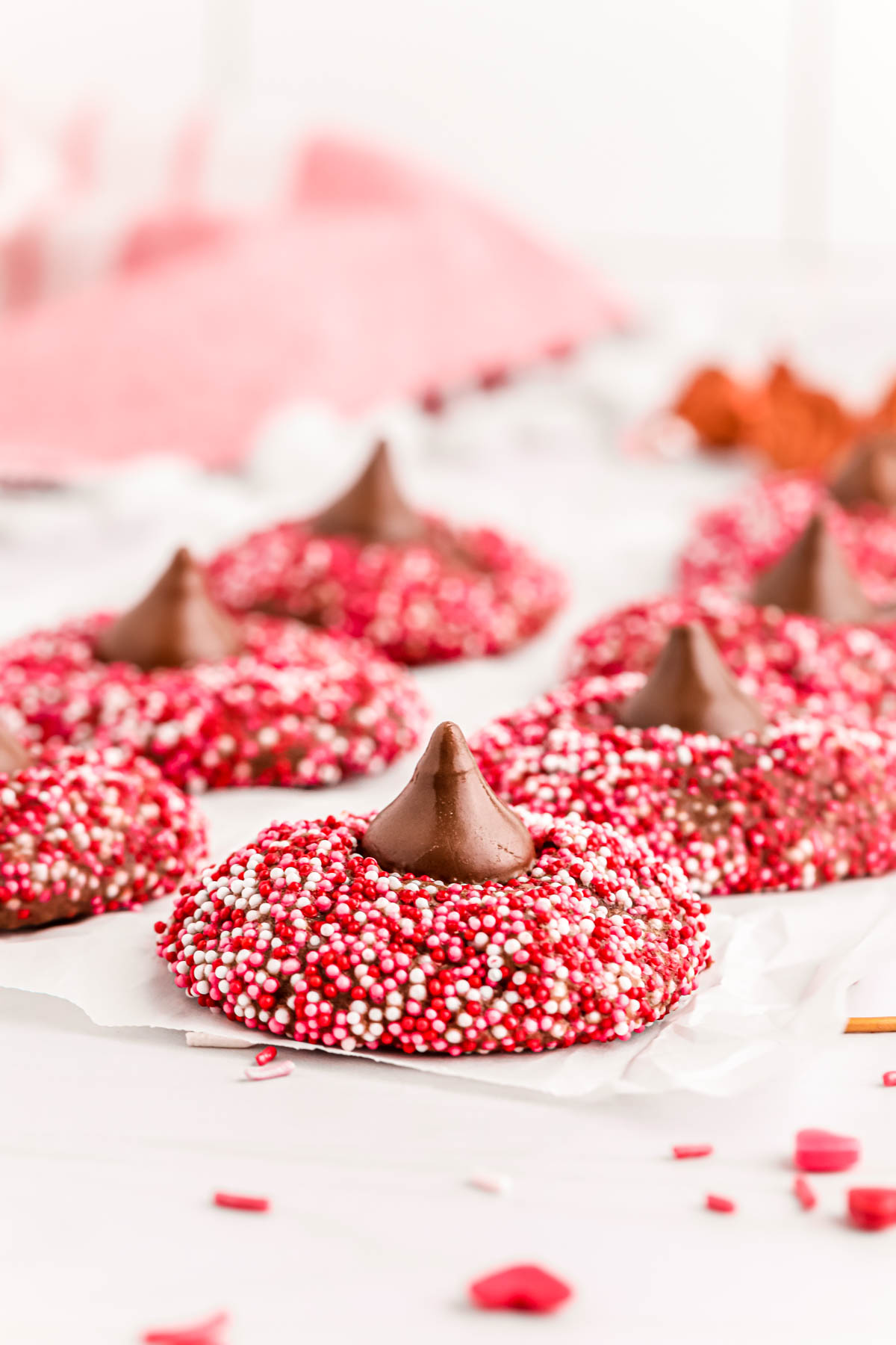 Chocolate blossom cookies with valentine's day sprinkles.