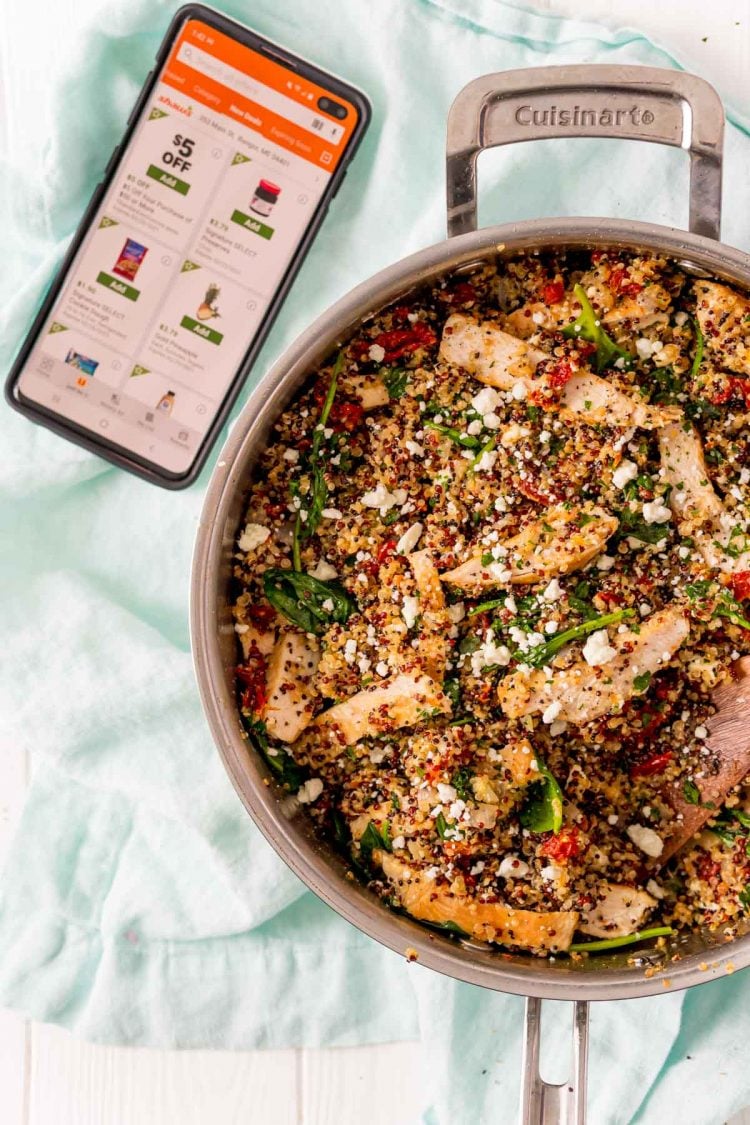 Overhead photo of a skillet with a chicken dish in it with a cell phone open to the Shaw's app.