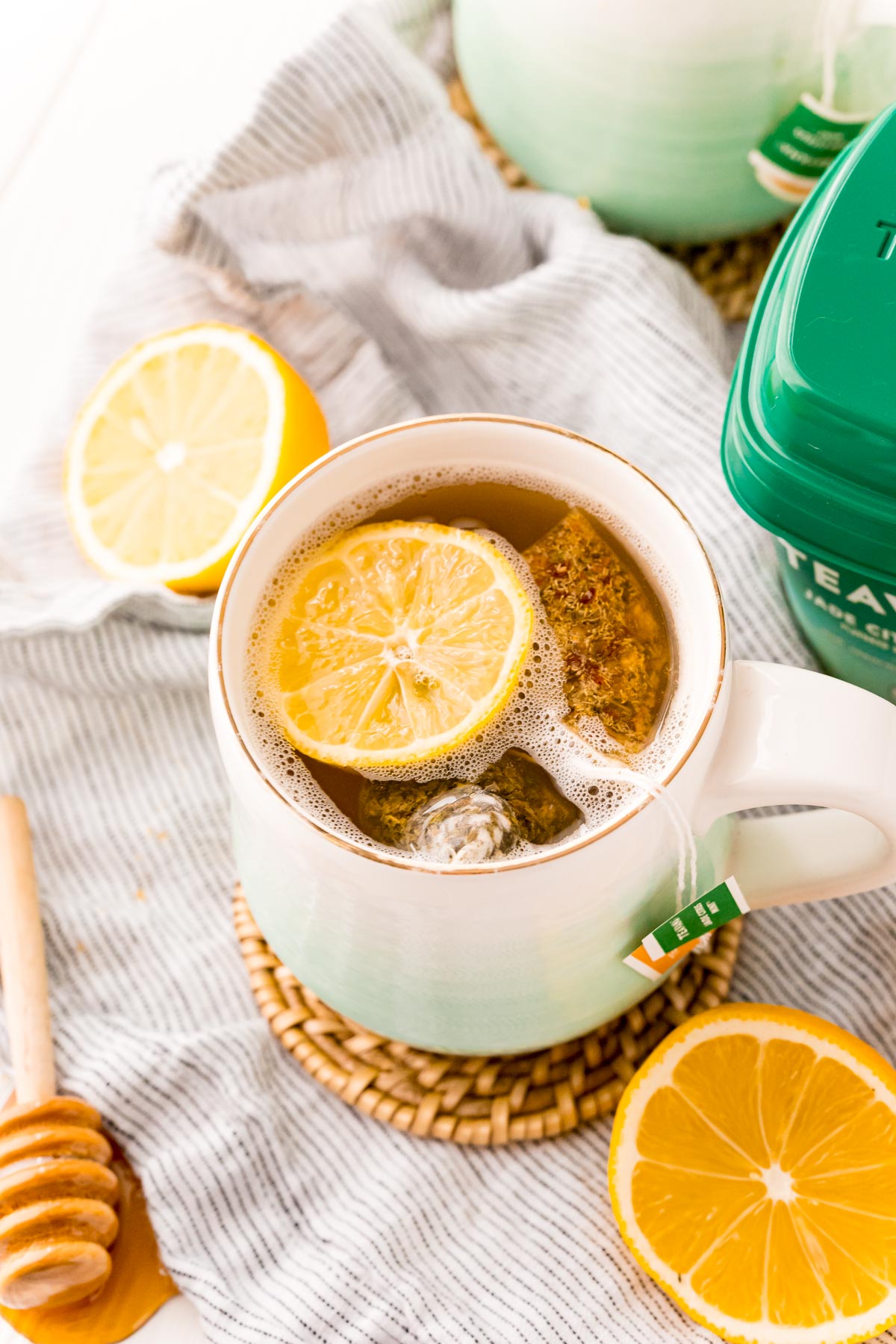 Starbucks medicine ball tea in a white and teal ombre mug.