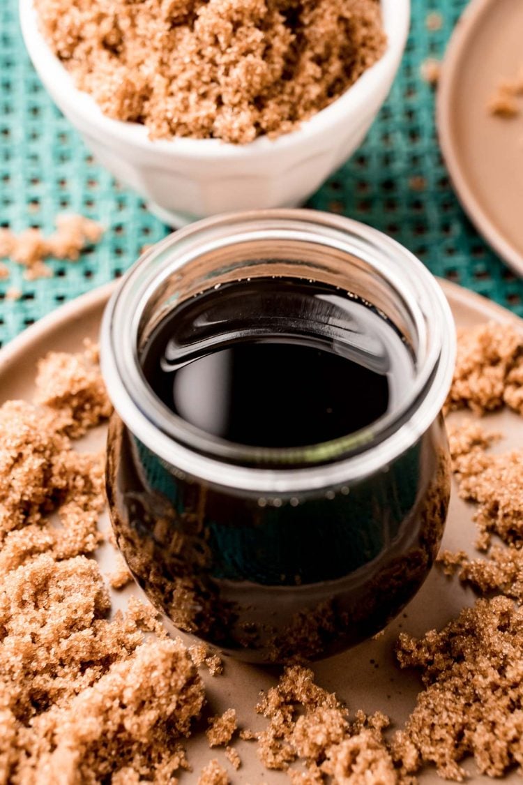 Close up photo of a jar with brown sugar simple syrup in it.