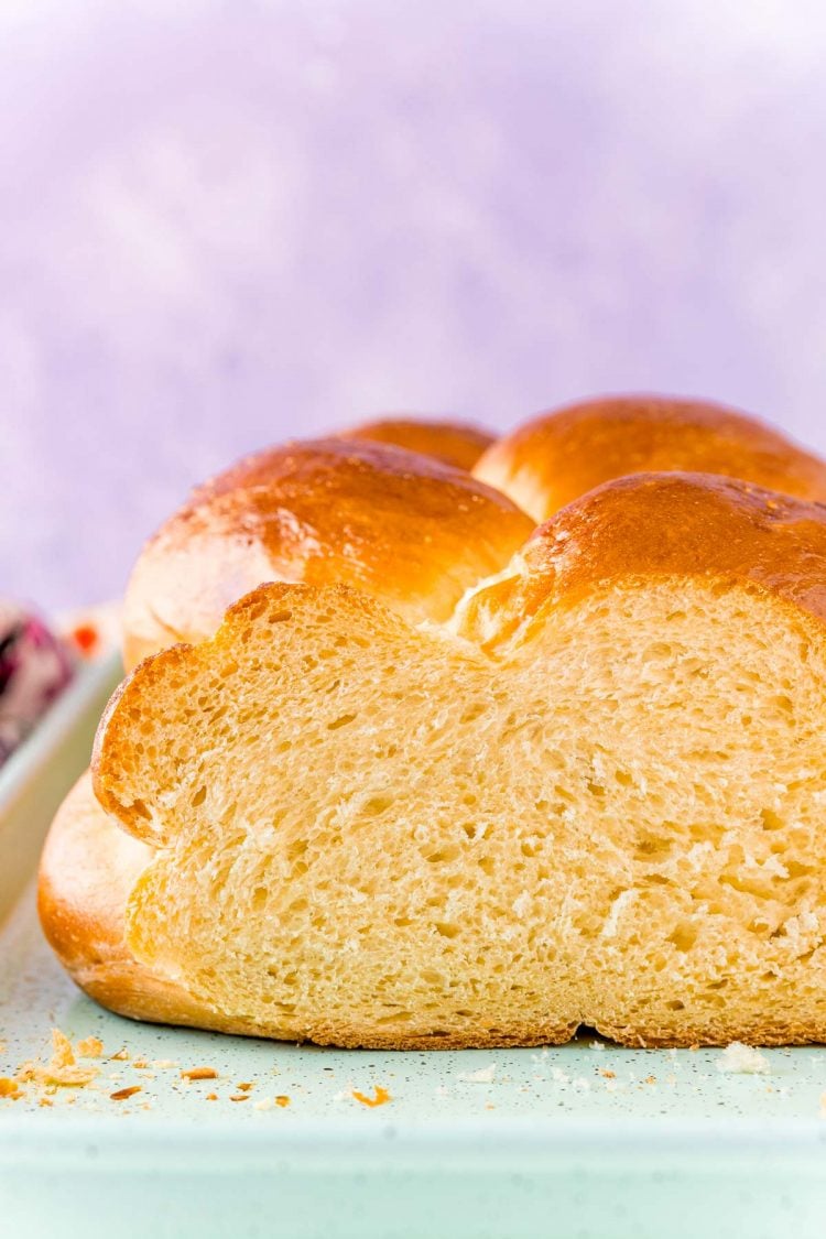 Close up photo of a loaf of Challah bread that's been sliced.