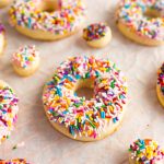 These Donut Cookies are soft, lightly sweetened cookies that are covered in easy-to-make icing and then topped with fun colorful sprinkles!