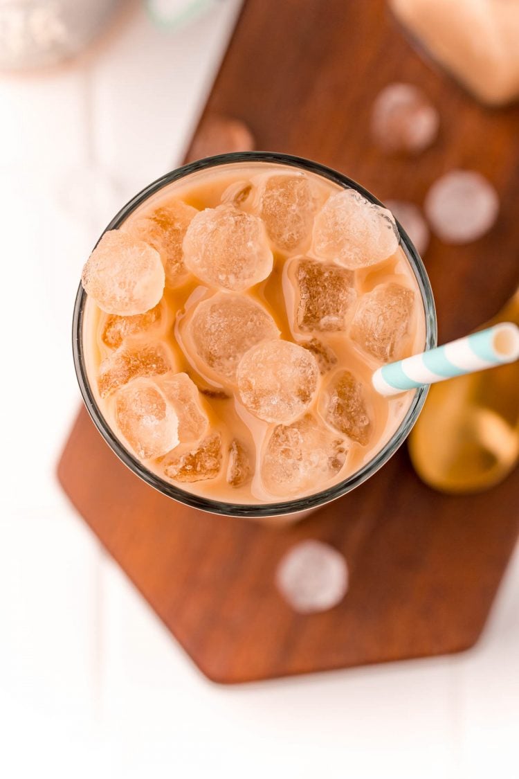 Overhead photo of a glass with an iced latte in it.